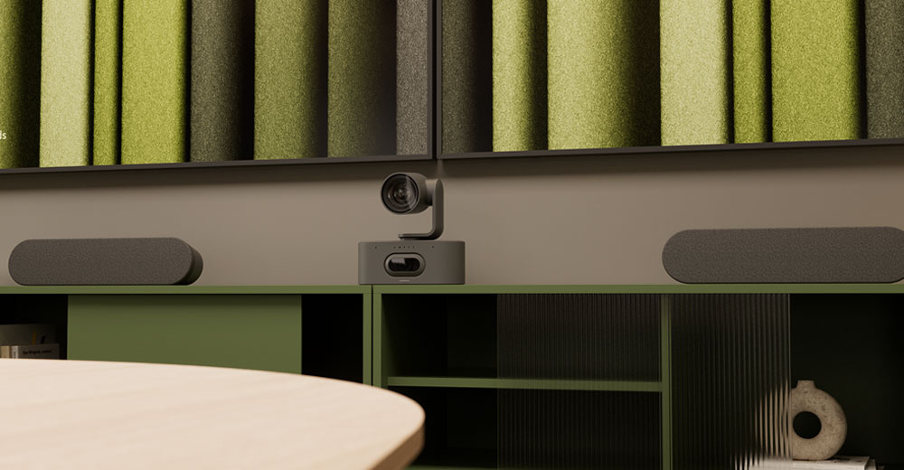 Logitech Rally AI camera with conference room audio system in modern office setup